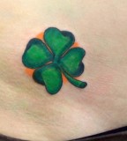 Green Four Leaf Clover Tattoo with Orange Background