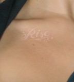 Rise Word White Ink Tattoo on Forearm