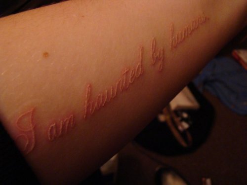 Quotes White Ink Tattoo on Forearm