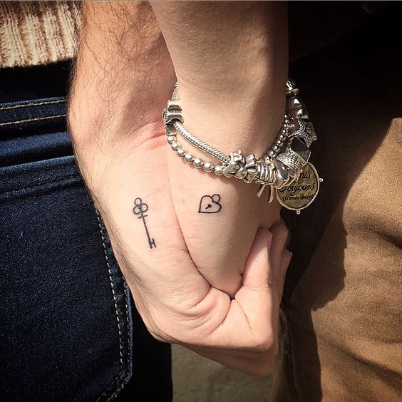 lock and key hand couples tattoos
