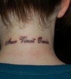 Back Of Neck Love Conquers Tattoo