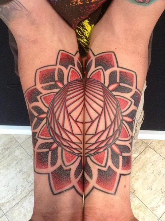 red and black mandala tattoo