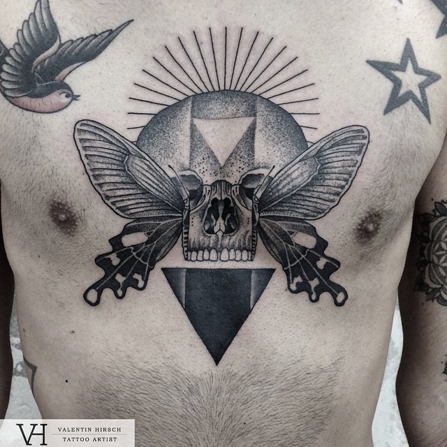 skull-and-wings-chest-tattoo-by-valentin-hirsch