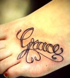 Grace's Name in Swirly Tattoo Design on Leg