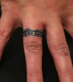 Marvelous Tattoo Design on Ring Finger