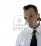 Caucasian Midadult Man With Tattoos And Piercings Wearing Necktie