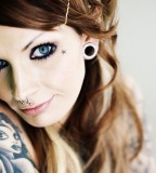 Blonde Girl With Tattoos And Piercings Image
