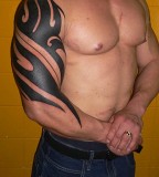 Half-Sleeve Tribal Tattoo Design for Amazing Look Muscle Men