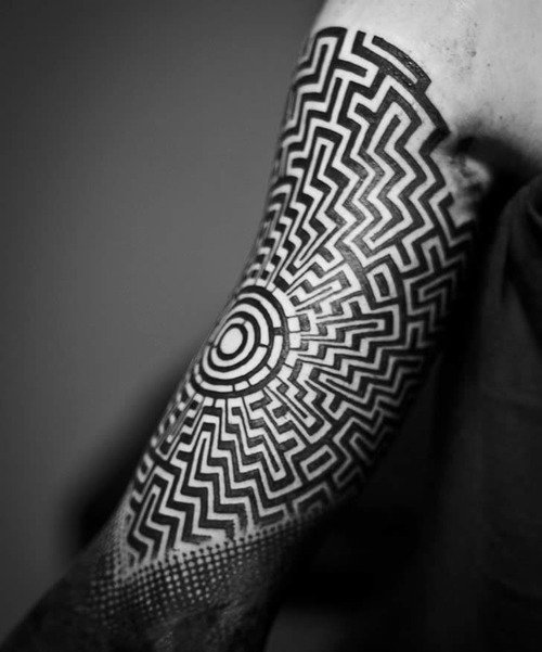 upper arm labyrinth tattoos for men