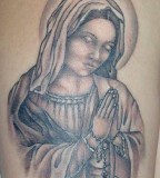 Beautiful Tattoo of the Virgin Mary Praying while Holding the Rosary