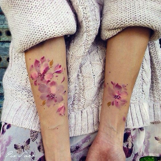 white and pink watercolor flower tattoo