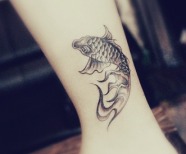 Fishes tattoos on legs
