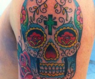 Skull and flowers tattoos