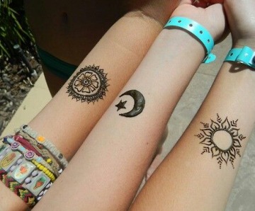 Moons tattoos on arms