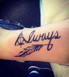 The deathly hallows feather tattoo