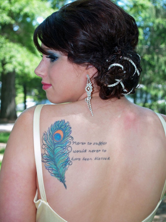 women tattoo designs back feather
