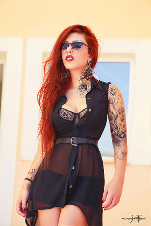 red hair girl tattoo girl in a black dress
