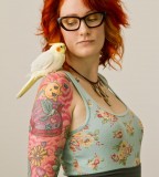 red hair girl tattoo girl with a bird