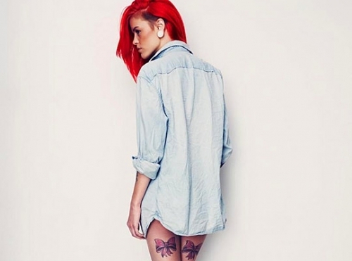 red hair girl tattoo red ribbons