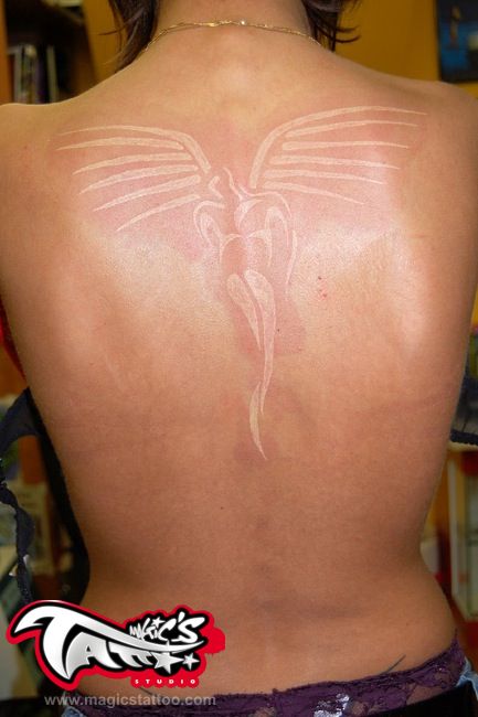 white ink tattoo angel