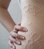 white ink tattoo flowered body