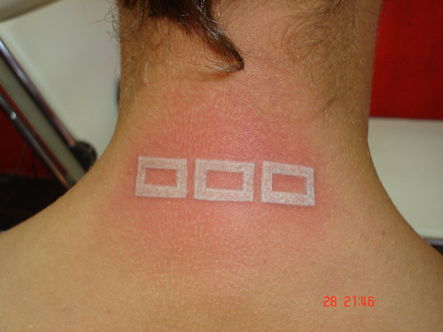 white ink tattoo symbols