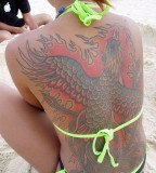beach girl tattoo full back tattoo flaming bird