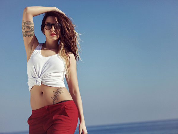 beach girl tattoo girl with round glasses