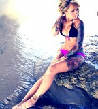 beach girl tattoo sleeve and half leg tattoo
