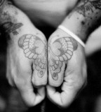 black and white photo butterfly hand tattoo