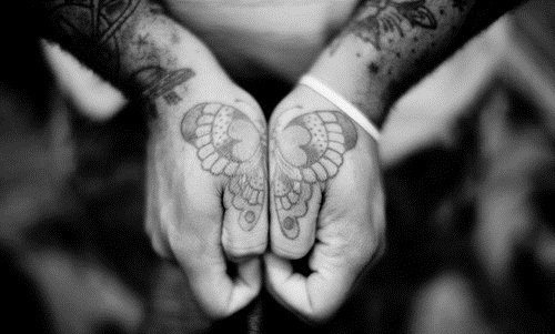 black and white photo butterfly hand tattoo