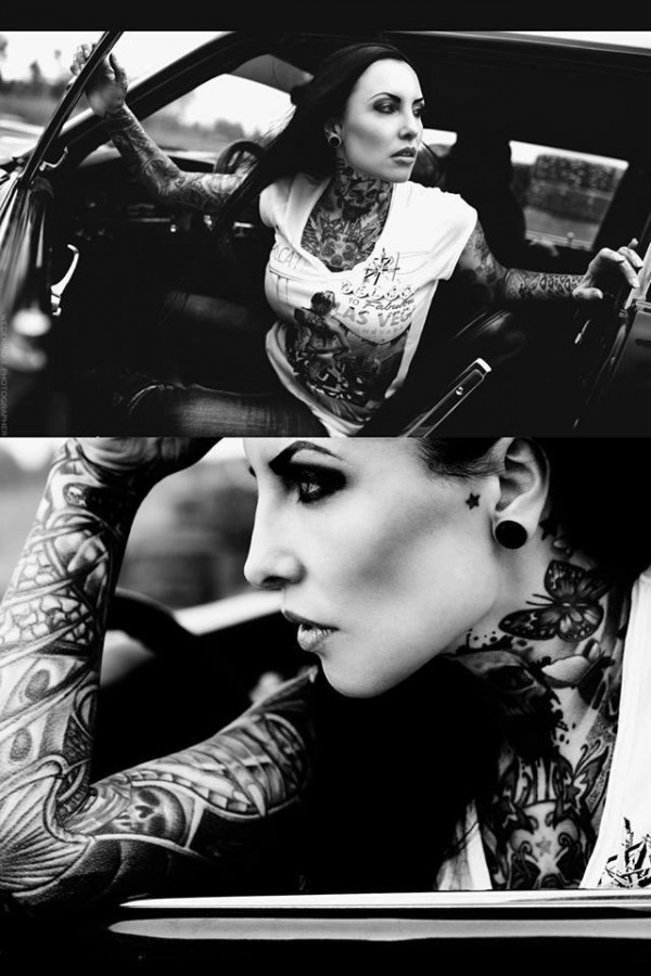 black and white photo girl in car half body tattoo