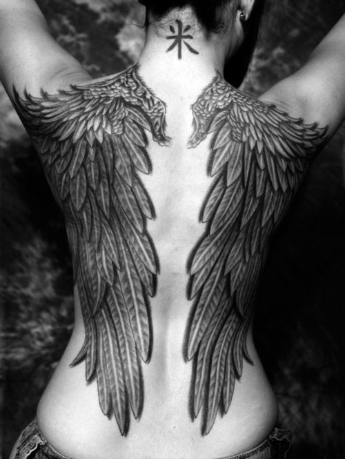 black and white photo huge wings back tattoo