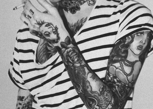 black and white photo smoking girl full sleeve tattoo