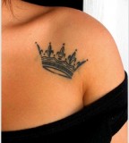 crown tattoo black work on shoulder