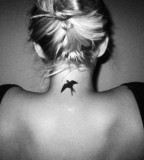 elegant bird tattoo back neck black work