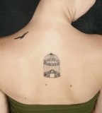 elegant bird tattoo bordcage on back