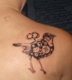 elegant bird tattoo clockwork bird