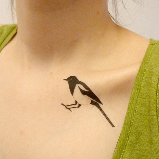 Elegant bird tattoo