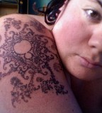 fractal tattoo girl with piercing