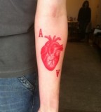 red ink tattoo anatomical heart