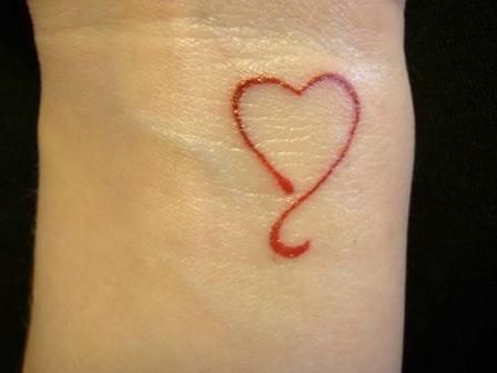 red ink tattoo minimalistic heart