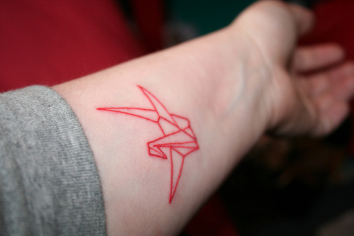 red ink tattoo paper crane