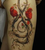 red ink tattoo two red birds treble clef