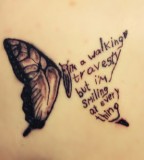 song lyric tattoo i'm a walking travesty but i'm smiling at every thing