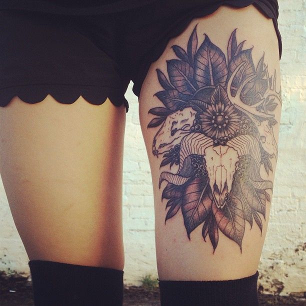 thigh tattoo scull leaves
