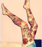 thigh tattoo slowers and sculs