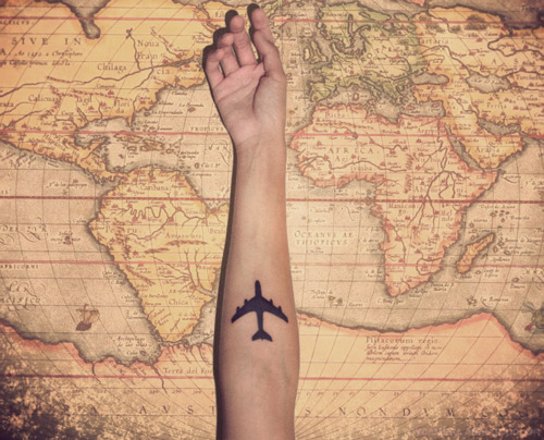 travel tattoo plane on arm