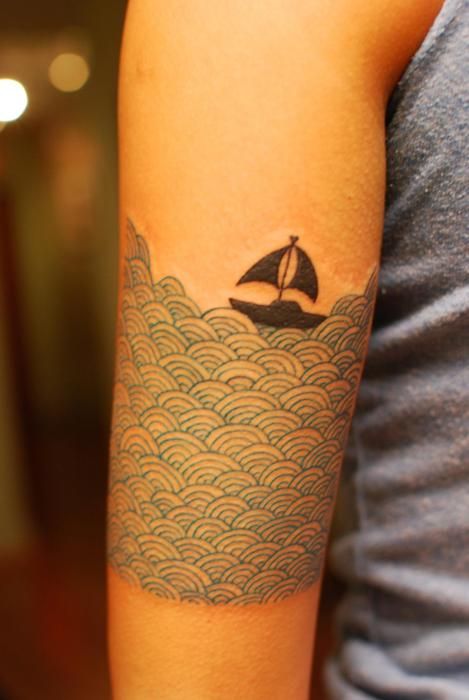 travel tattoo small boat