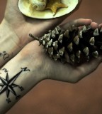 travel tattoo world map and compass pinecone